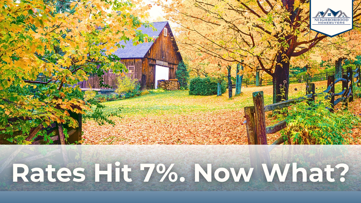 Massachusetts colonial home in fall with text reading "Rates Hit 7%. Now What?